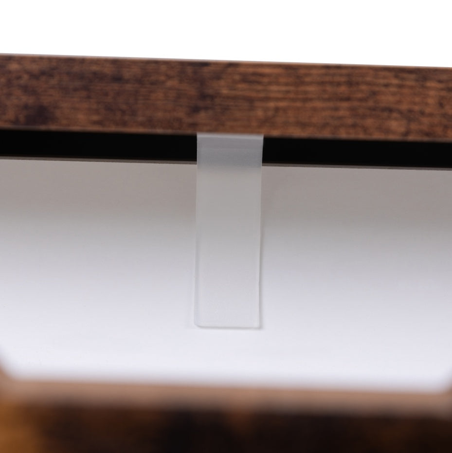 Close-up of a wooden frame with a glass panel on a white background