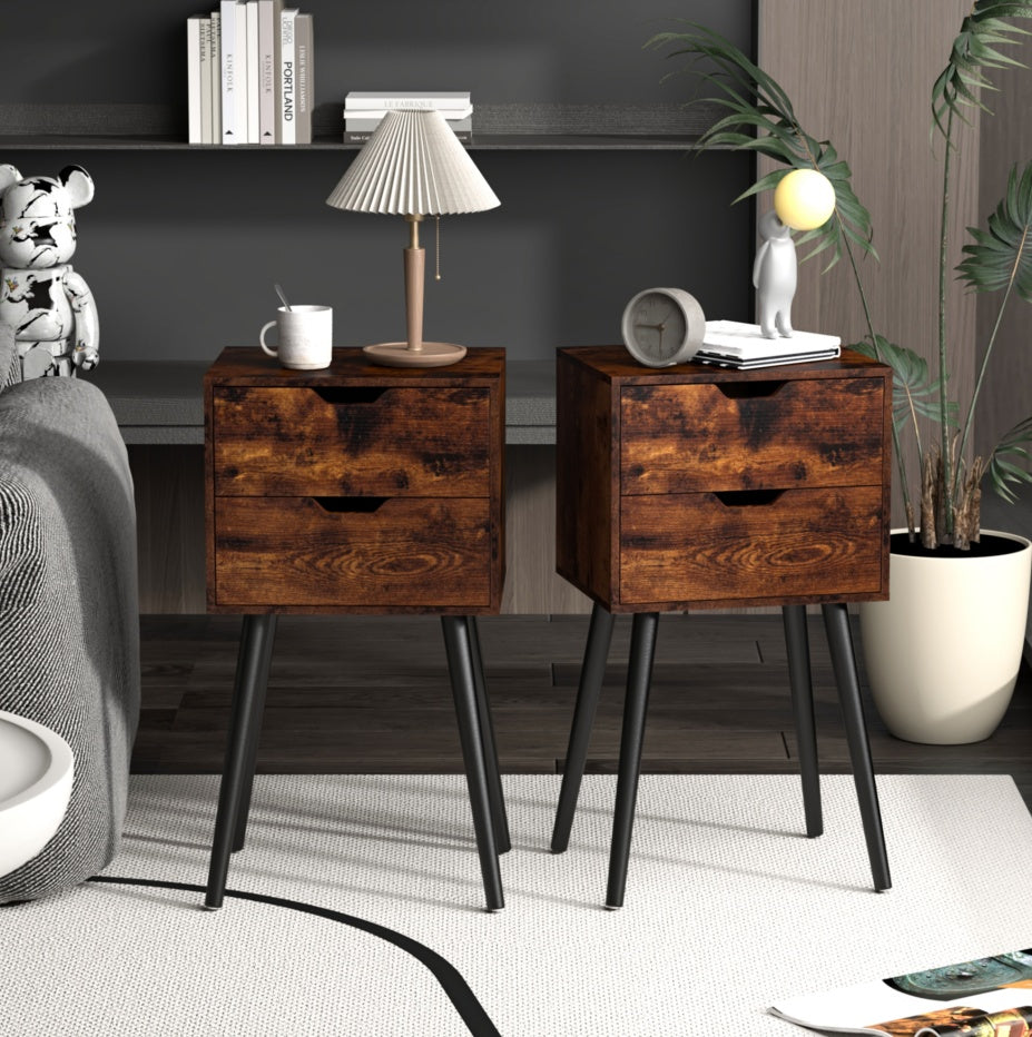 set of Two wooden nightstands with black legs in a bedroom setting.