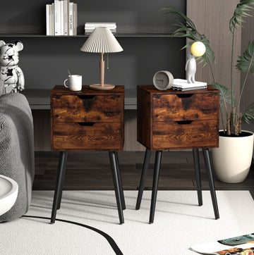 set of Two wooden nightstands with black legs in a bedroom setting.
