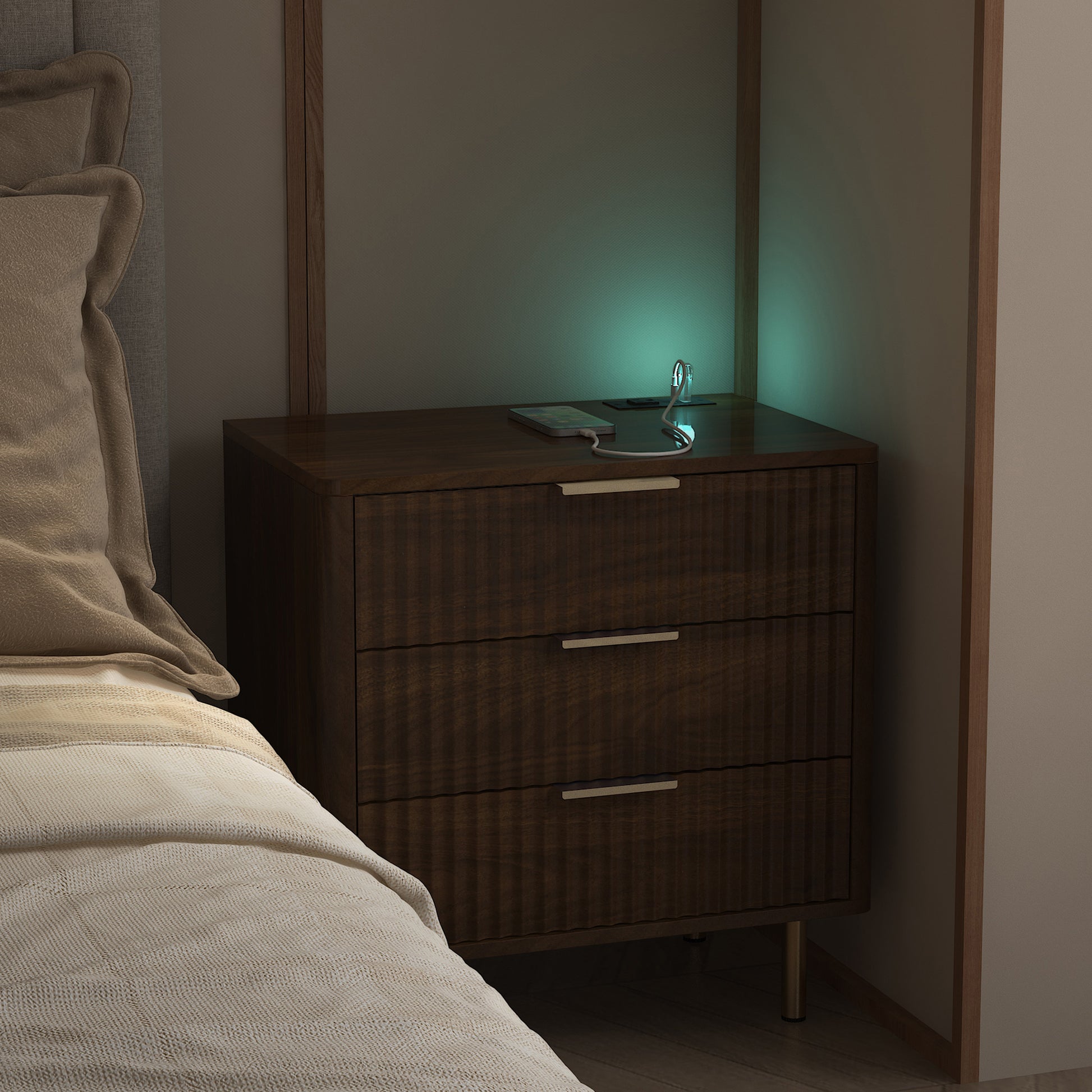 Wooden nightstand with a lamp next to a bed in a dimly lit room