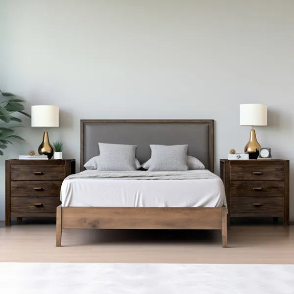 Wooden bed with matching nightstands and lamps in a bedroom setting.